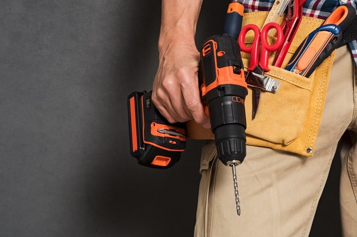 worker holding tools